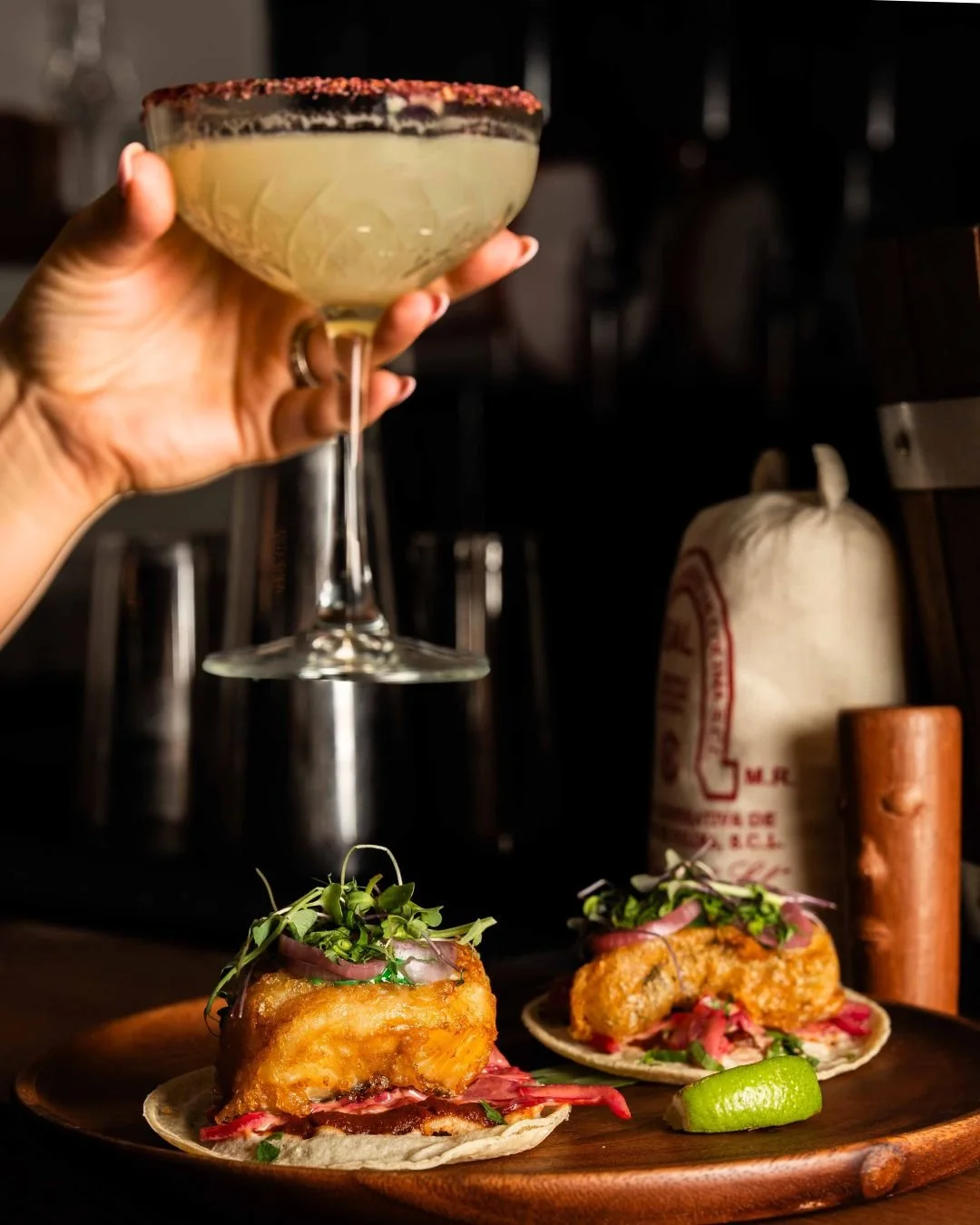 A cocktail and tacos at Copal
